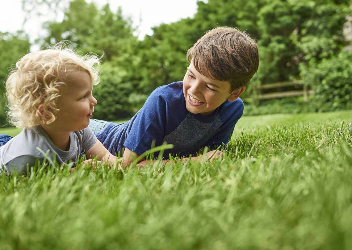 5 Kids laughing in the yard